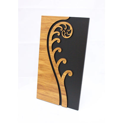 Decorative wall panel with wooden and black design on a white background