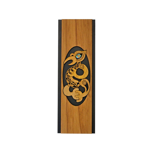 Wooden panel with a stylized dragon design on a white background
