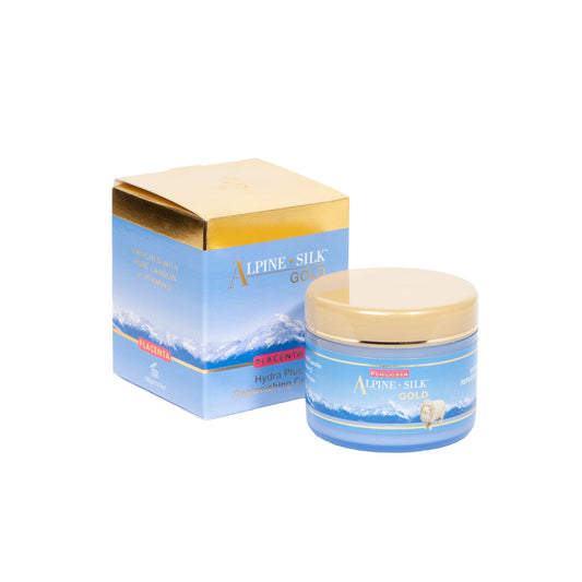 A product image showing Alpine Silk Gold Placenta Hydra Plus Replenishing Crème packaging and the cream jar. The packaging has a blue and gold color scheme with text and the brand's logo, and the jar is labelled with the product name and hint of a mountain scene.