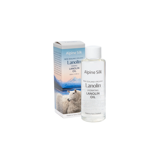 A product image featuring Alpine Silk organic lanolin firming lanolin oil in a clear bottle with a white label, next to its packaging box which has a similar design and branding.