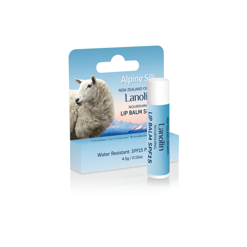 A product image featuring Alpine Silk organic lanolin nourishing lip balm with SPF15 protection, packaged in a blue and white tube with a sheep graphic and product information.