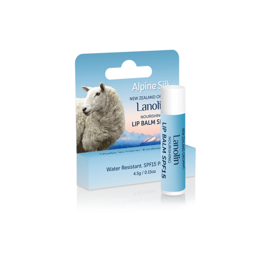 A product image featuring Alpine Silk organic lanolin nourishing lip balm with SPF15 protection, packaged in a blue and white tube with a sheep graphic and product information.