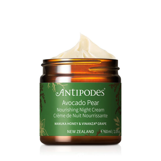 A jar of Antipodes Avocado Pear Nourishing Night Cream with a green label, indicating the main ingredients such as avocado and grape, and the claim of being a nourishing night cream.