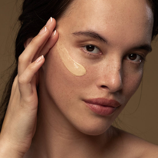 woman applies Antipodes Diem Vitamin C Pigment-Correcting Water Cream on her face 