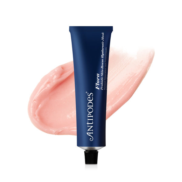 A blue tube of Antipodes Flora Probiotic Skin-Rescue Hyaluronic Mask with its pink creamy content visible at the opening.