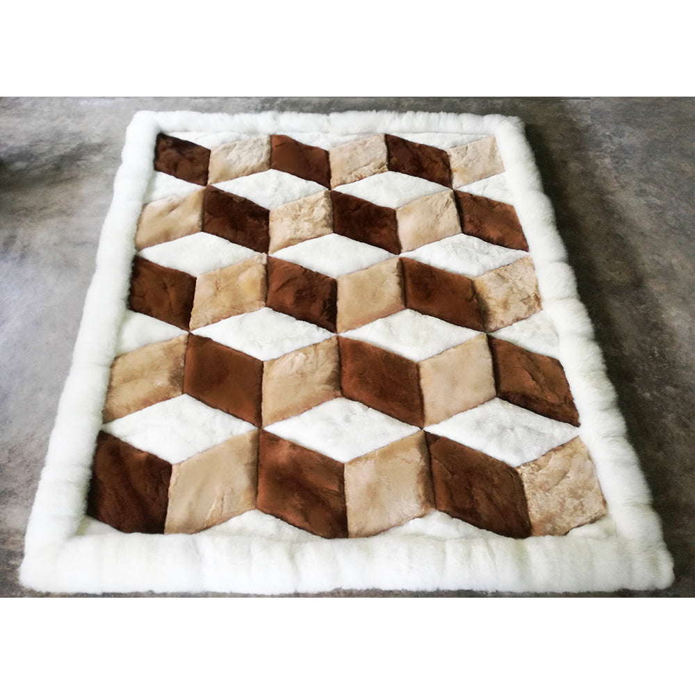 A geometric patterned rug made of alpaca fleece, featuring diamond-shaped blocks in beige, brown, and white colors.