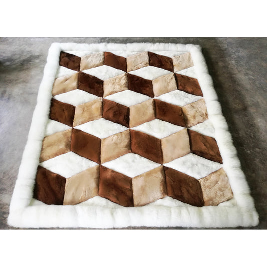 A geometric patterned rug made of alpaca fleece, featuring diamond-shaped blocks in beige, brown, and white colors.