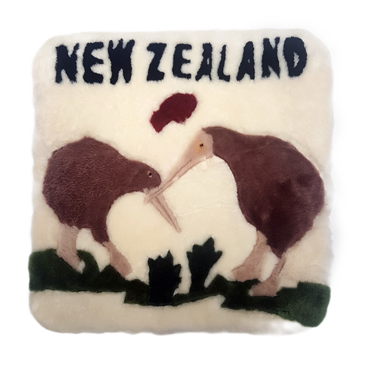 A square-shaped wool cushion with a design featuring two stylized kiwi fruits and the text 'NEW ZEALAND' on a white background.