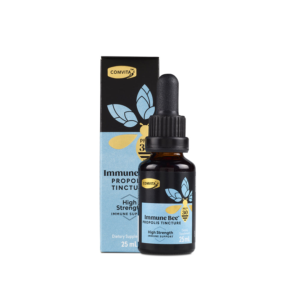 A bottle of Comvita Propolis Extract Alcohol Free with a dropper, next to its packaging box.