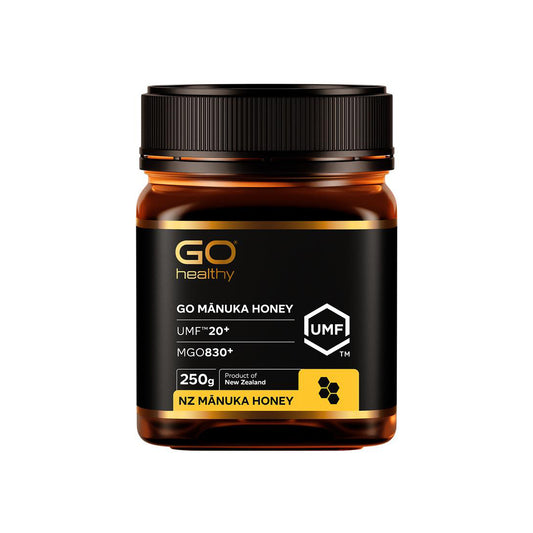 Jar of GO Manuka Honey with black lid on a white background
