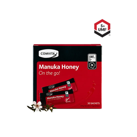 A red box of Comvita UMF 5+ Manuka Honey in sachets, with the brand and product name displayed on the packaging, indicating it contains 30 portions of honey.